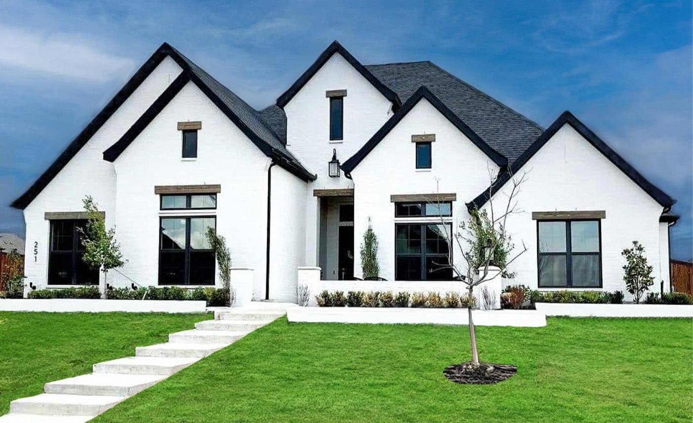 Front elevation of a white home in Bridlewood of High Springs from Sterling Builders