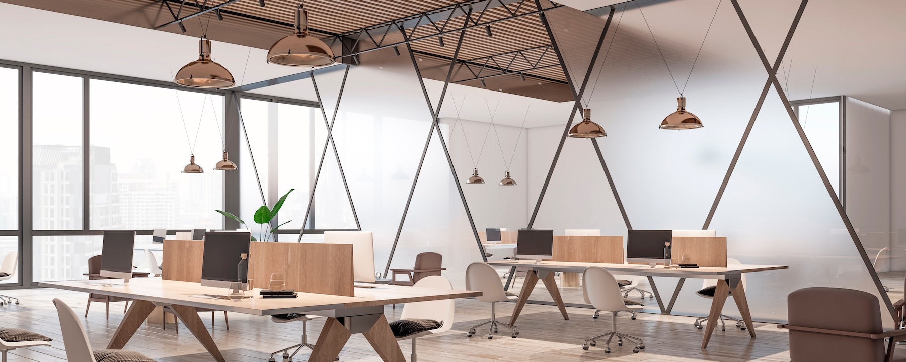 Modern open office with wooden desks and glass paneled walls